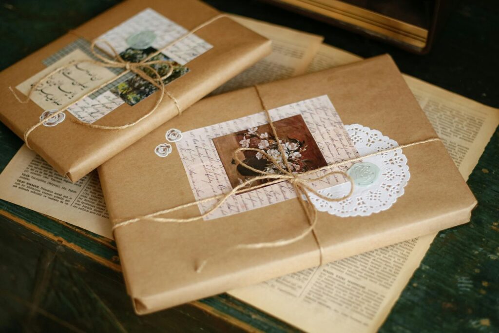 Beautifully wrapped vintage gift packages with decorative elements on a wooden table.